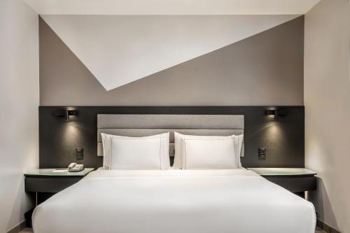 Habitación Deluxe con cama grande del hotel Melia Paulista. Foto 2
