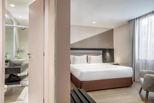 Habitación Deluxe con cama grande del hotel Melia Paulista. Foto 3