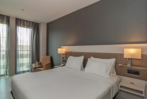 Habitación Doble con vistas a la ciudad del hotel SH Hotel Colon Valencia. Foto 2