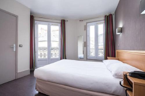 Habitación Doble con baño privado del hotel Bonséjour Montmartre. Foto 2