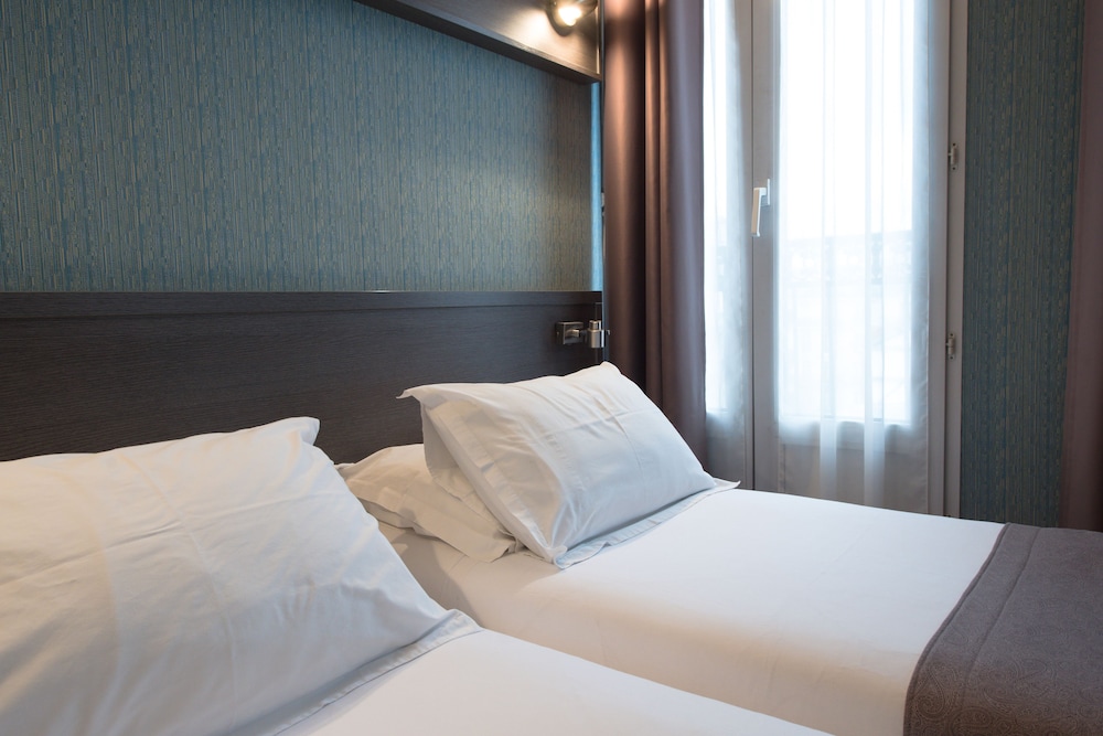 Habitación con 2 camas individuales del hotel Home Latin