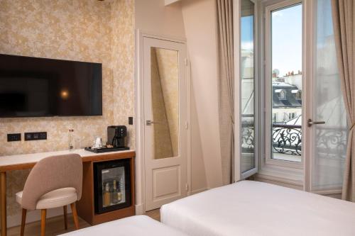 Habitación Doble Deluxe - 1 o 2 camas del hotel Hôtel des Champs-Elysées. Foto 1
