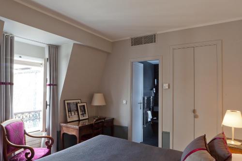 Habitación Clásica del hotel Des Saints Peres. Foto 6