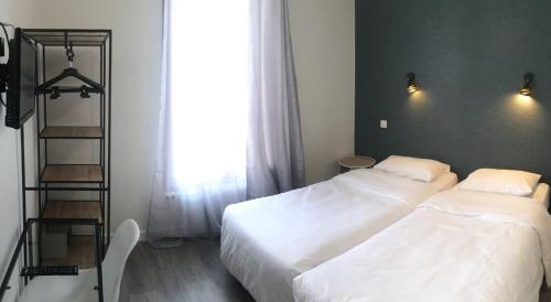 Habitación Triple Confort del hotel Hôtel du Maine. Foto 3