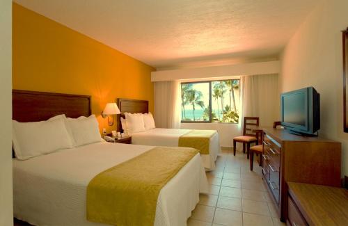Habitación Doble Deluxe del hotel Canto Del Sol Puerto Vallarta All Inclusive. Foto 3