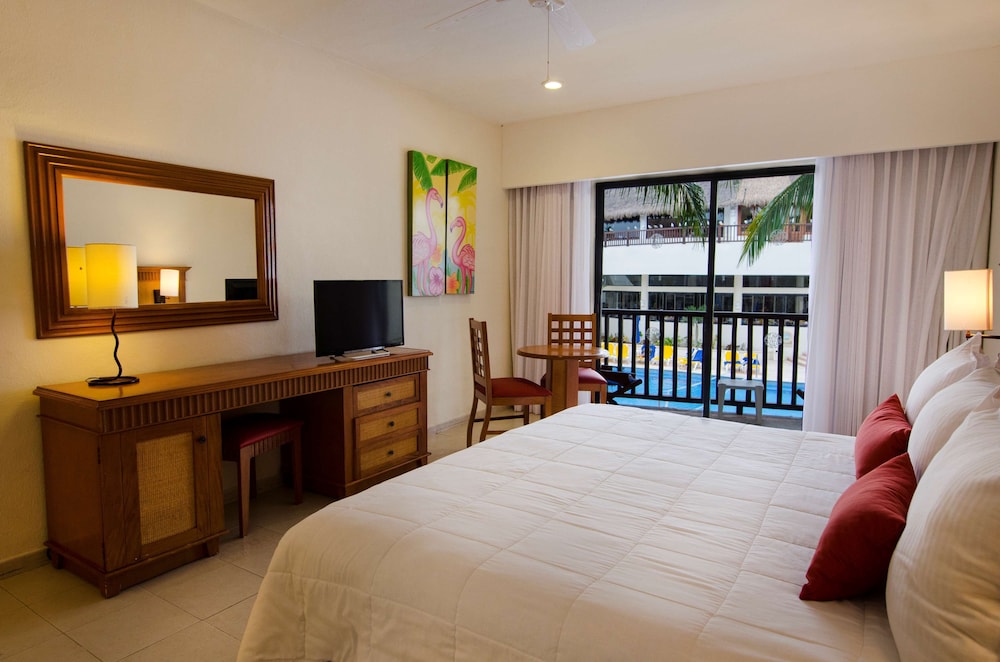 Habitación Premium, vistas al jardín del hotel The Reef Coco Beach and Spa- Optional All Inclusive. Foto 1