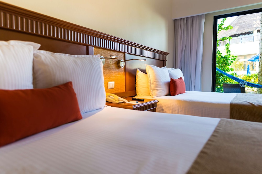 Habitación superior, vistas al jardín del hotel The Reef Coco Beach and Spa- Optional All Inclusive