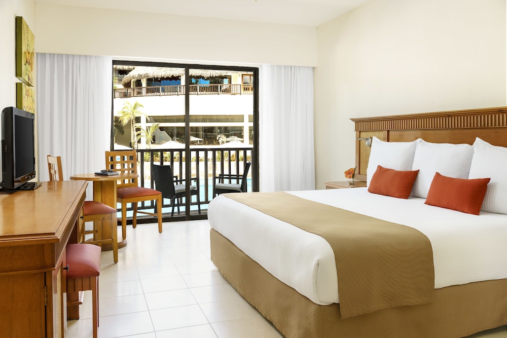 Habitación superior, vistas al jardín del hotel The Reef Coco Beach and Spa- Optional All Inclusive. Foto 5