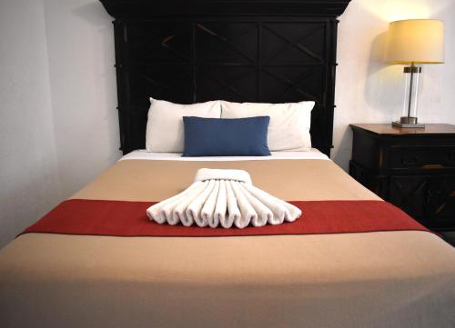 Habitación Cuádruple con balcón del hotel Hacienda Paradise Hotel by BFH. Foto 3