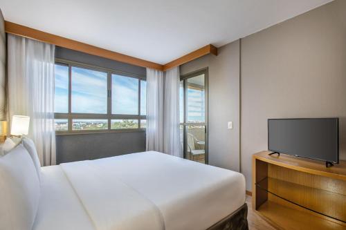 Habitación Premium - Cama extragrande del hotel Brasil 21 Suites Affiliated By Melia. Foto 5