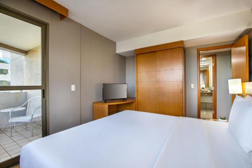 Habitación Premium - Cama extragrande del hotel Brasil 21 Suites Affiliated By Melia. Foto 7
