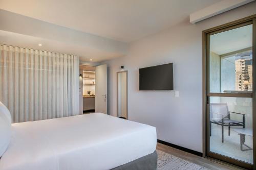 Suite Junior Premium - Cama extragrande del hotel Brasil 21 Suites Affiliated By Melia. Foto 4