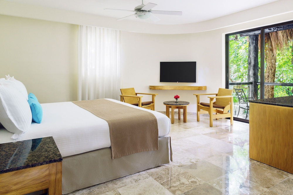 Habitación superior, 1 cama de matrimonio grande del hotel The Reef Playacar Resort and Spa - Optional All Inclusive. Foto 2