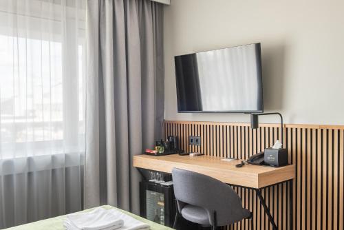 Habitación Triple Estándar del hotel Airinn Vilnius. Foto 1