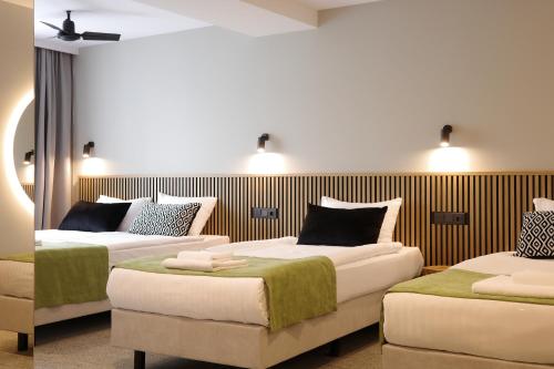 Habitación Cuádruple Estándar del hotel Airinn Vilnius. Foto 1