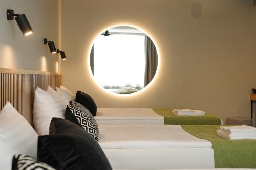 Habitación Cuádruple Estándar del hotel Airinn Vilnius. Foto 4