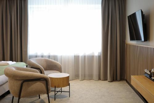 Habitación Confort Estándar del hotel Airinn Vilnius. Foto 3