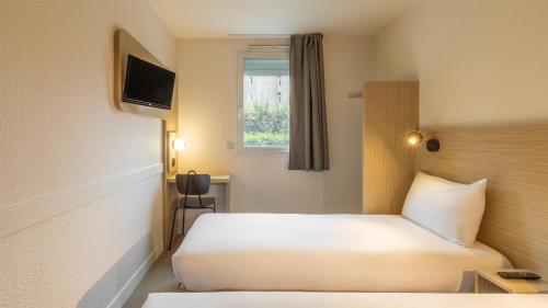 Habitación Doble Estándar - 2 camas del hotel Kyriad ECO - Roissy - Aéroport Paris-Charles de Gaulle. Foto 5