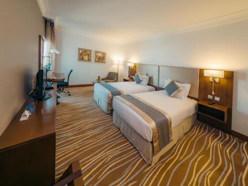 Habitación Doble Deluxe - 2 camas del hotel Copthorne Downtown Abu Dhabi. Foto 1