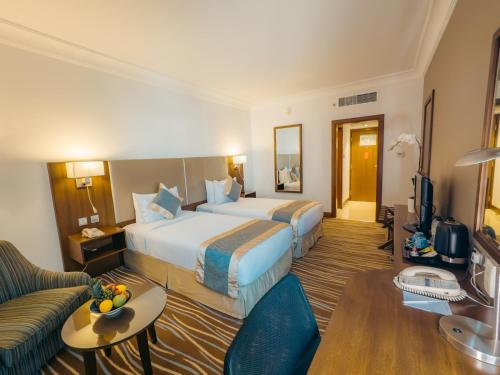 Habitación Doble Deluxe - 2 camas del hotel Copthorne Downtown Abu Dhabi. Foto 2
