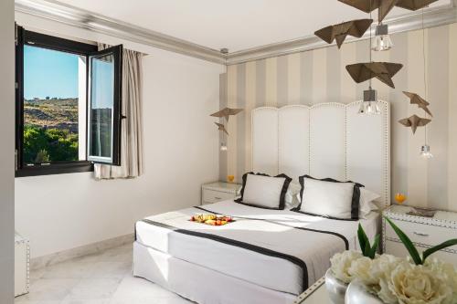 Habitación Doble con vistas a las montañas - 2 camas del hotel Mitsis Selection Alila. Foto 1