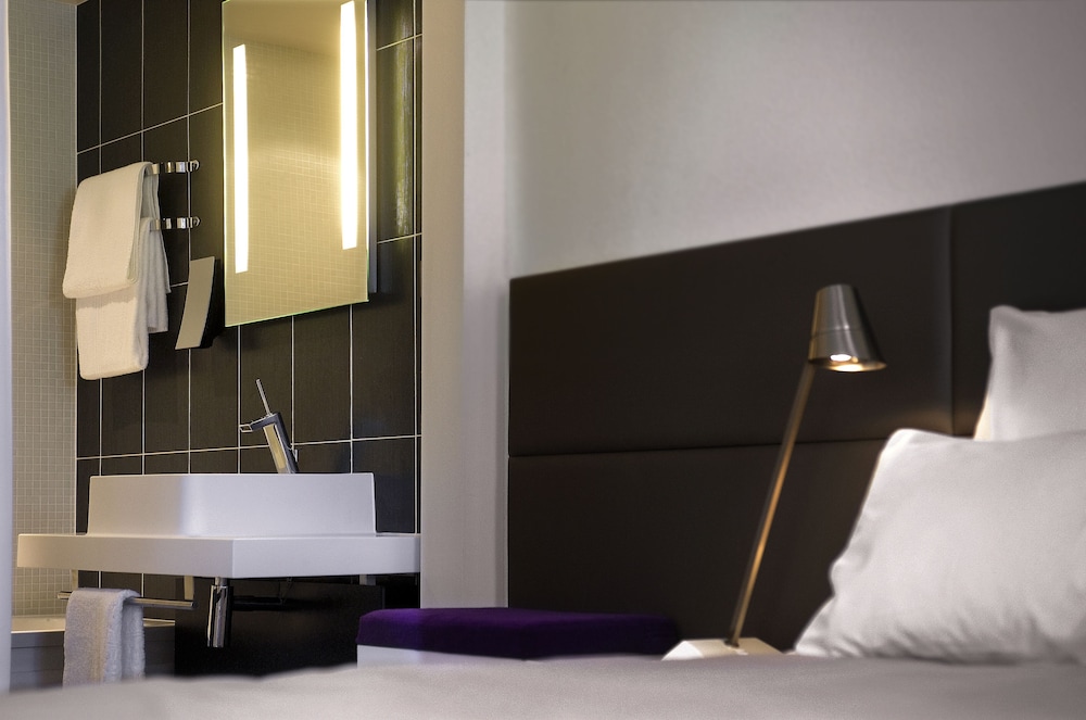 Suite familiar, varias camas del hotel Novotel Suites Paris Issy Les Moulineaux. Foto 10