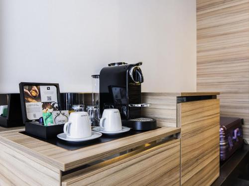 Habitación Executive con cama grande del hotel Novotel Amsterdam City. Foto 4