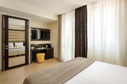 Habitación Doble Deluxe - 1 o 2 camas del hotel The Square Milano Duomo. Foto 6
