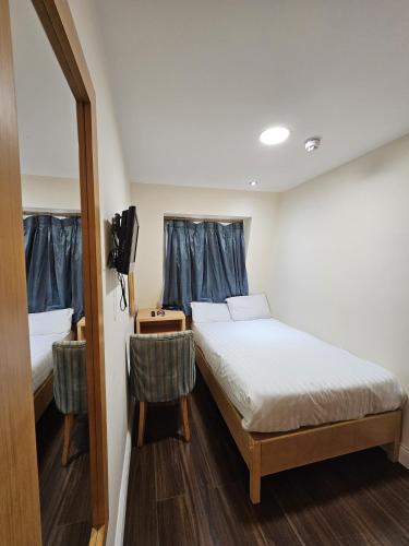 Habitación Individual Económica del hotel Cromwell International. Foto 1