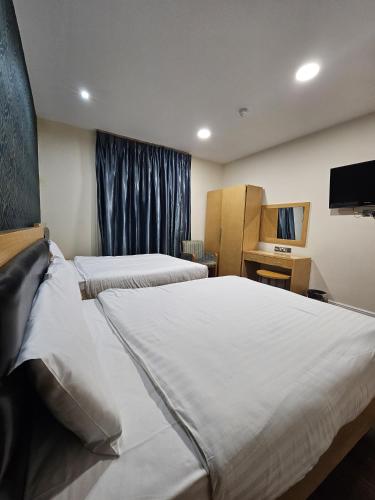 Habitación Familiar Económica del hotel Cromwell International. Foto 3