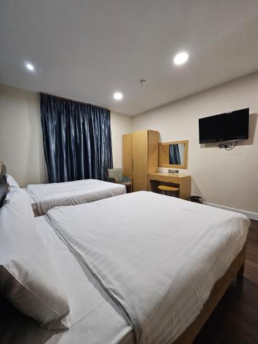 Habitación Familiar Económica del hotel Cromwell International. Foto 4