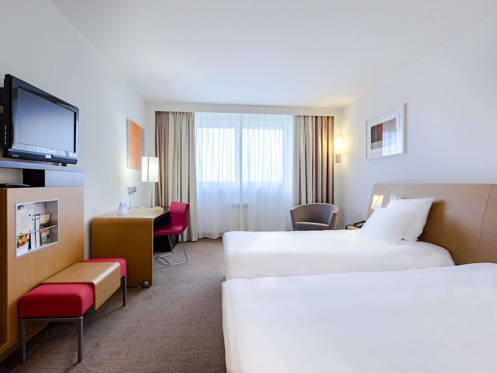 Habitación Superior Novation con dos camas individuales del hotel Novotel Krakow City West. Foto 1