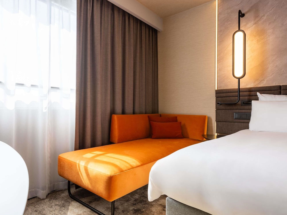 Habitación superior, varias camas del hotel Novotel Warszawa Centrum. Foto 1