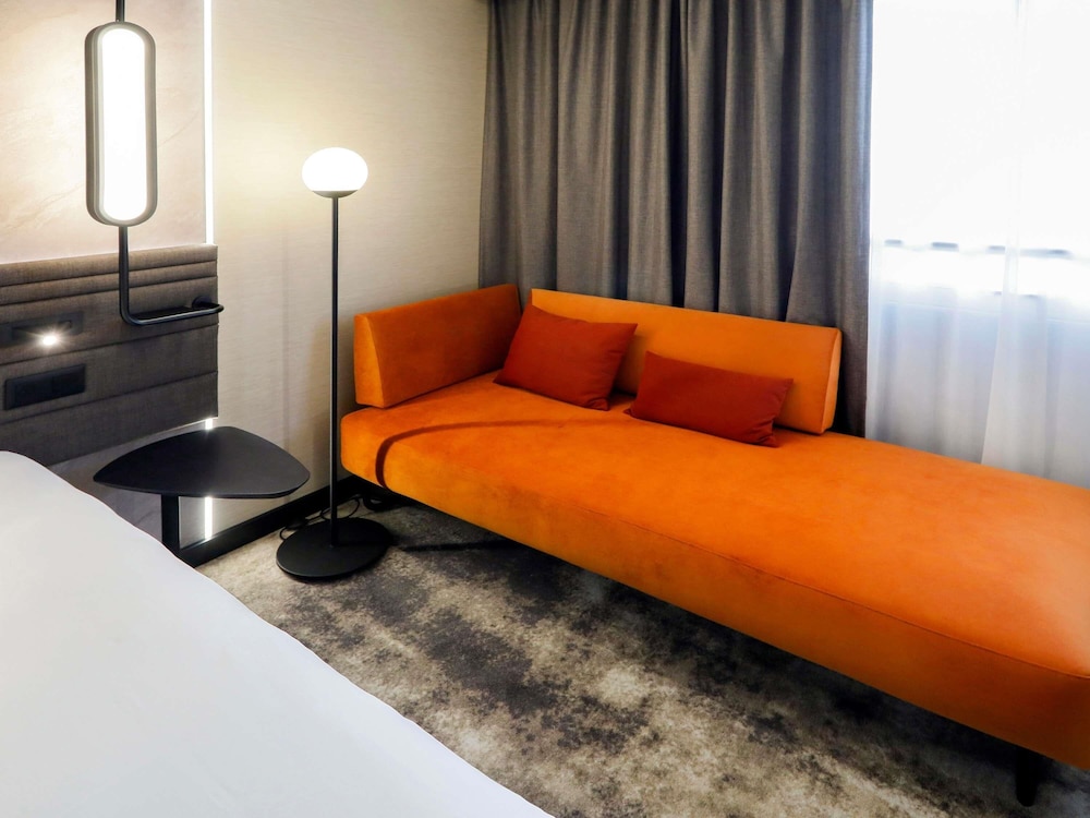 Habitación superior, varias camas del hotel Novotel Warszawa Centrum. Foto 2