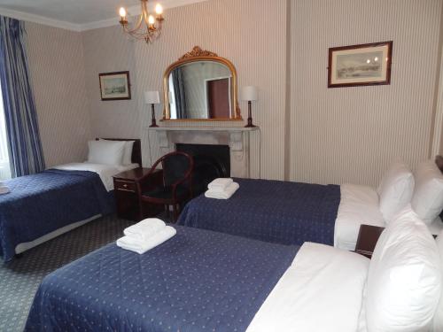 Habitación Triple del hotel Regency House. Foto 5