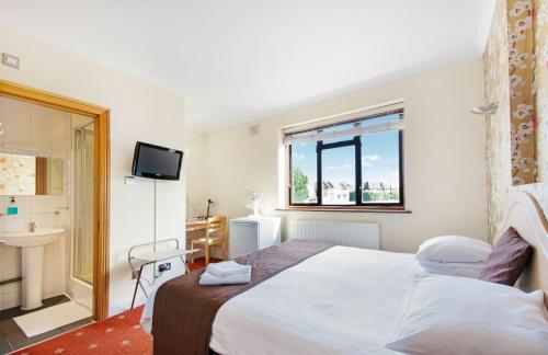 Habitación Doble Deluxe del hotel The Brent. Foto 5