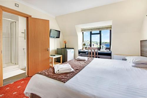 Habitación Doble Deluxe del hotel The Brent. Foto 6