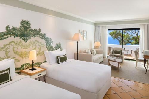 Habitación Doble Grand Deluxe con balcón y vistas al océano - 2 camas del hotel Pine Cliffs, a Luxury Collection Resort. Foto 1
