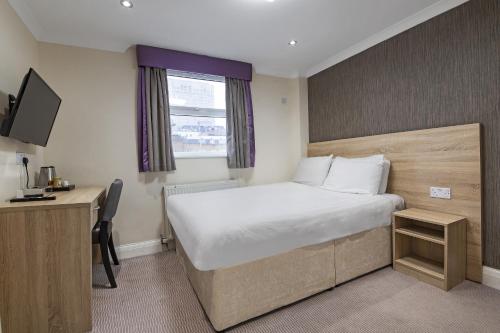 Habitación Doble Estándar del hotel OYO London 24 Sussex. Foto 3
