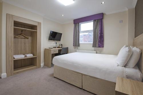 Habitación Doble Estándar del hotel OYO London 24 Sussex. Foto 4