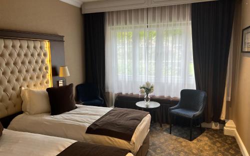 Habitación Triple Estándar del hotel Warren House. Foto 3