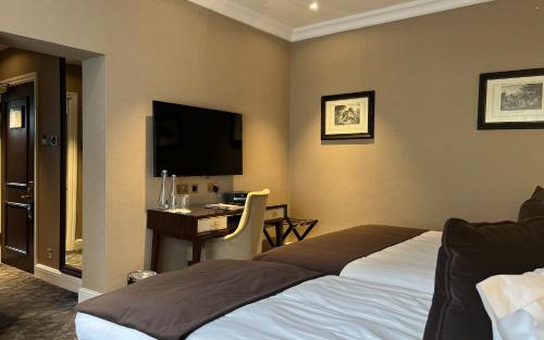 Habitación Triple Estándar del hotel Warren House. Foto 5