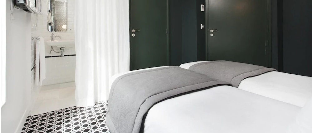 Habitación clásica con 2 camas individuales del hotel Emile. Foto 1