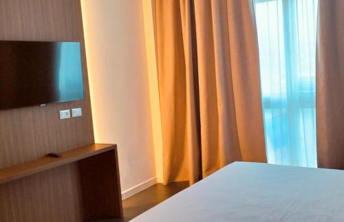 Habitación Deluxe con cama extragrande del hotel IDEA HOTEL MILANO MALPENSA AIRPORT. Foto 7