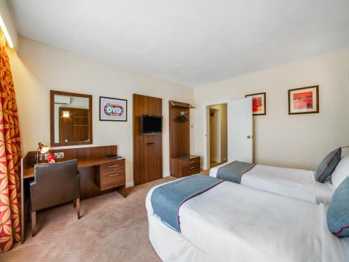 Habitación Doble Estándar - 2 camas del hotel Oyo The Bridge House. Foto 4