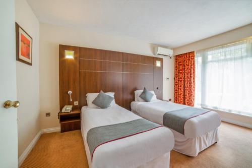 Habitación Doble Estándar - 2 camas del hotel Oyo The Bridge House. Foto 11