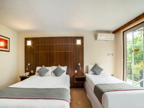 Habitación Triple Deluxe del hotel Oyo The Bridge House. Foto 1