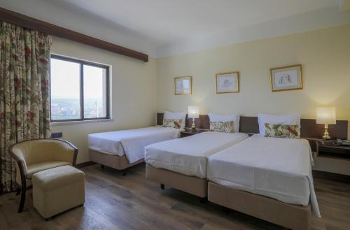 Habitación Doble con cama supletoria del hotel D. Luís. Foto 10