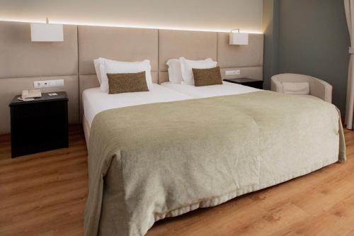 Habitación Doble Estándar - 2 camas del hotel Covilha Dona Maria Affiliated By Melia. Foto 1