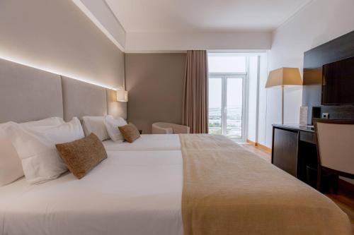 Habitación Doble Estándar - 2 camas del hotel Covilha Dona Maria Affiliated By Melia. Foto 4